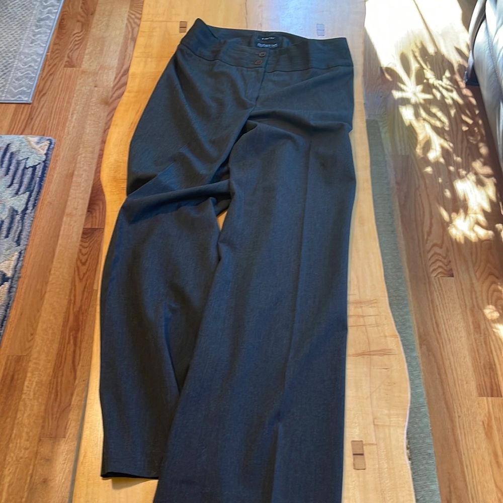 Gray poly rayon spandex blend pants with front zipper opening and 2 top buttons